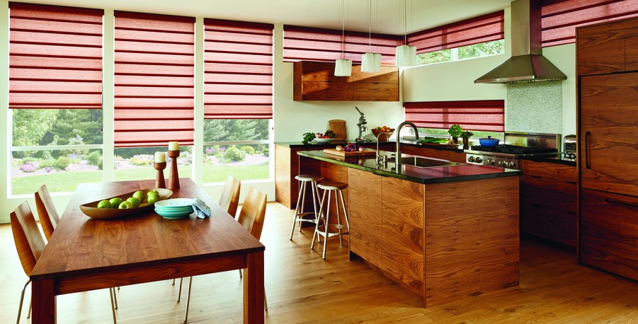Hunter Douglas PowerView motorized shades covering windows in a kitchen.
