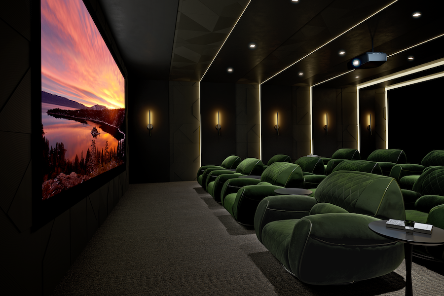 Home movie theater with Sony projector displaying a sunset water scene on large screen.