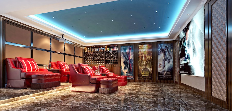 Home theater with red leather seating, floor to ceiling movie posters and star ceiling.