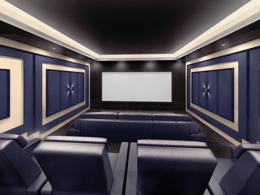 A home theater featuring two rows of seating, a large screen, and special blue acoustic panels on the walls.