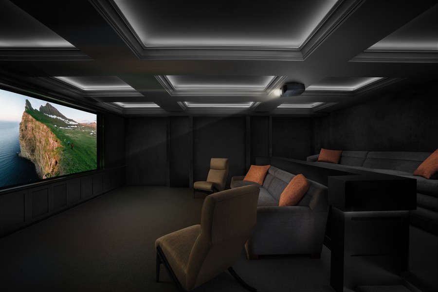 A luxury home theater where a landscape is displayed on the screen.