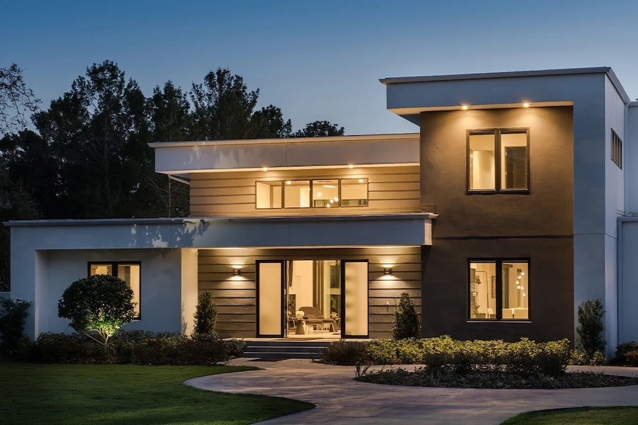 two story home illuminated at dusk with smart lighting solutions