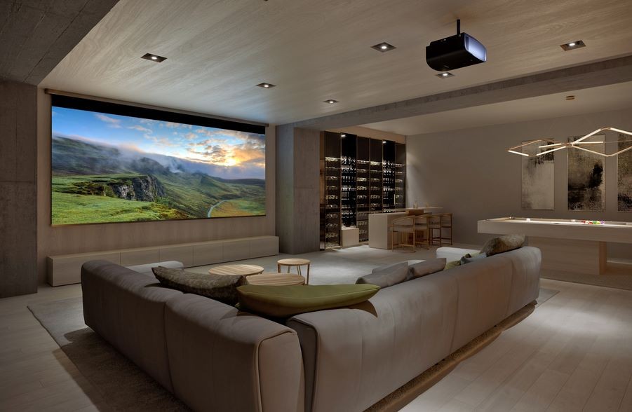  A casual home theater with a large screen, Sony projector, wine bar, and pool table.